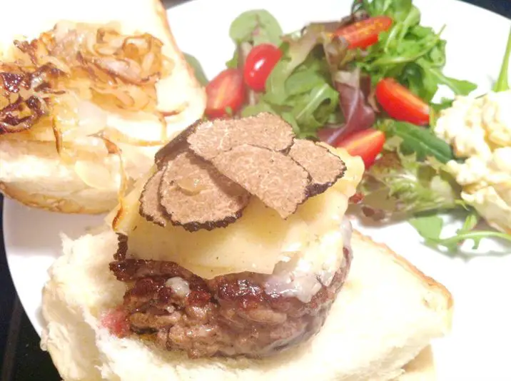 Ultimate Luxury Burger: Beef with Shaved Truffle and Apres Soleil Cheese on Toasted Cholla Buns, Lay The Table